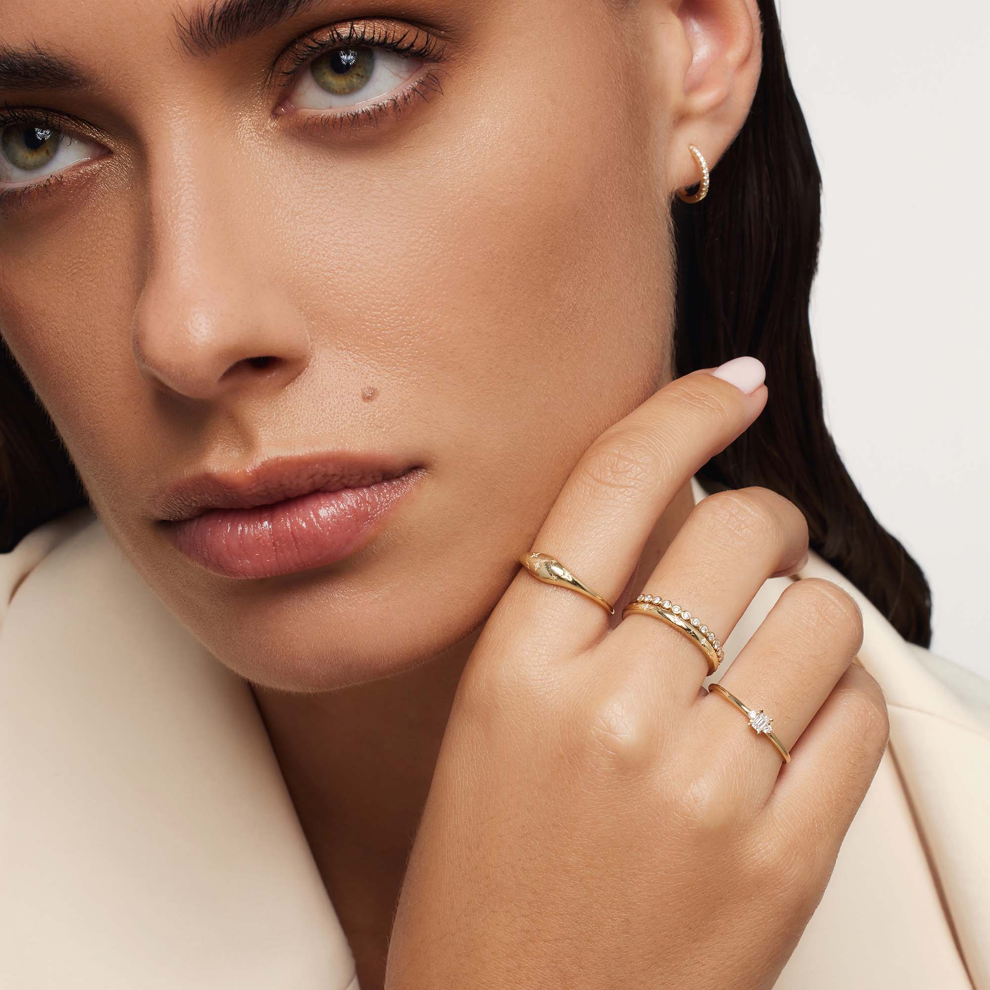 Golden ring in the shape of a diamond